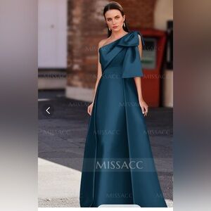 Elegant one shoulder satin gown.